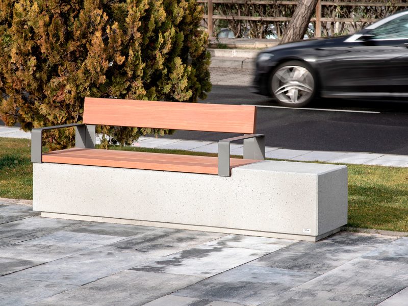 Boulevard with street furniture with armrests and wooden backrest