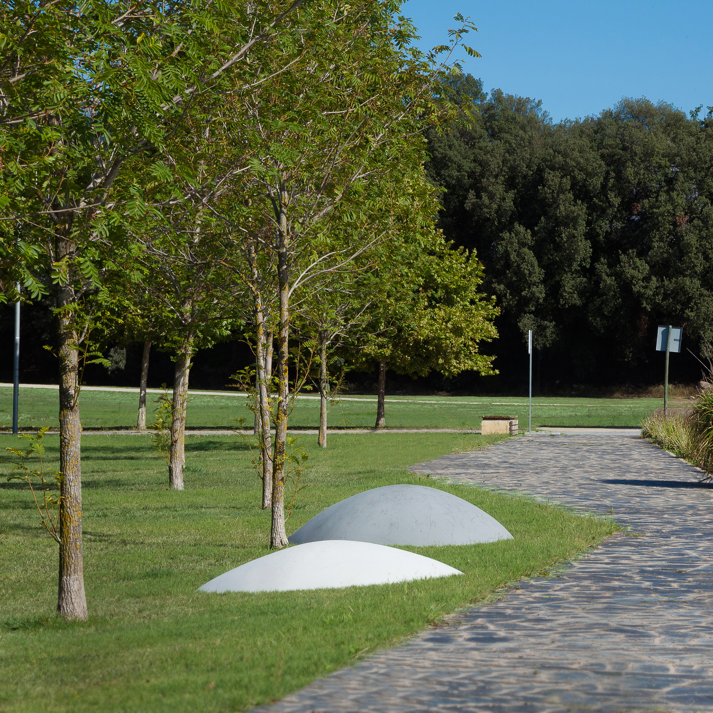 Public park with mountain-shaped concrete landscape elements