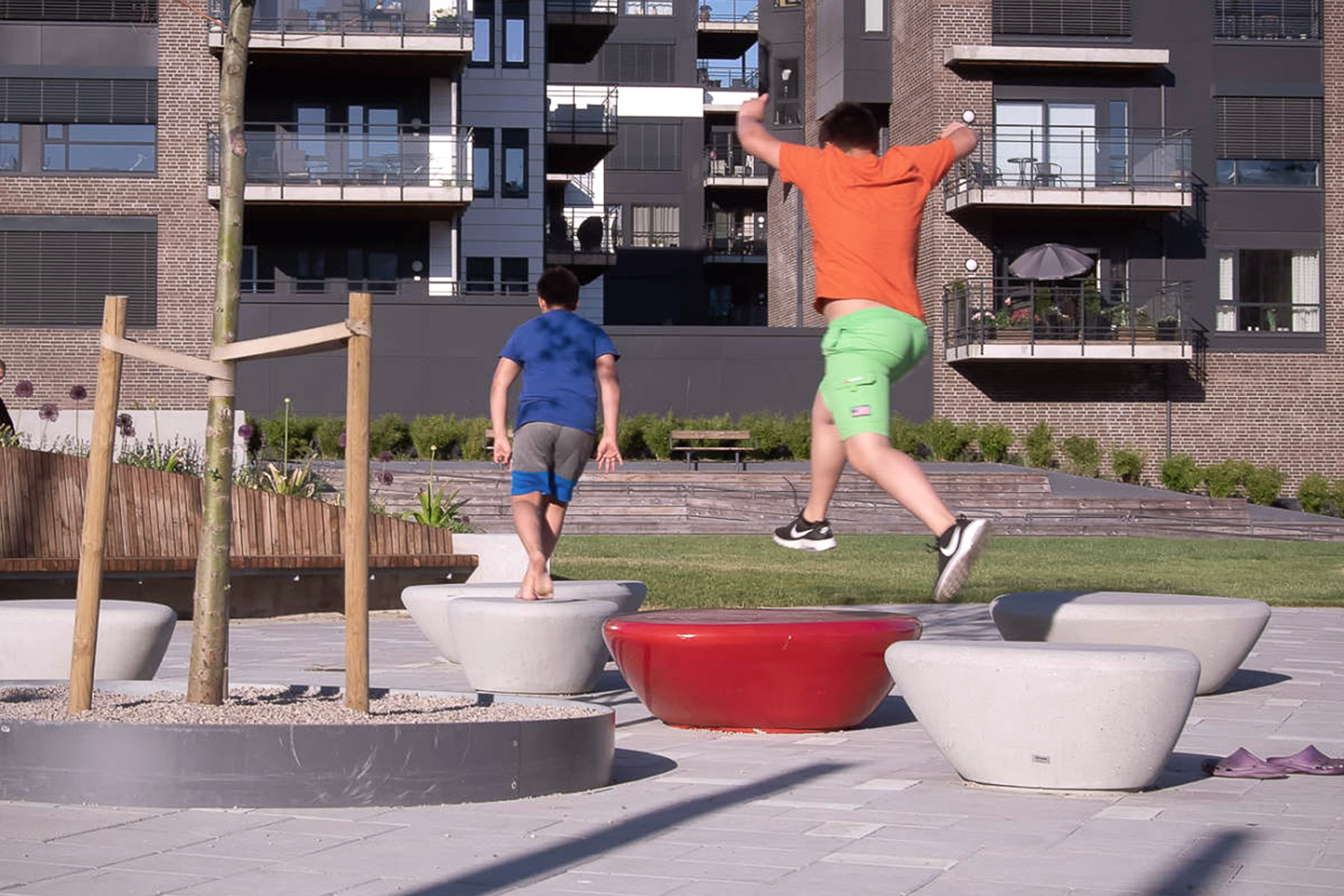 Children playing parkour at the Arendal park in Norway