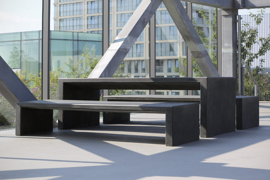 Set of black concrete benches and tables from Durbanis.