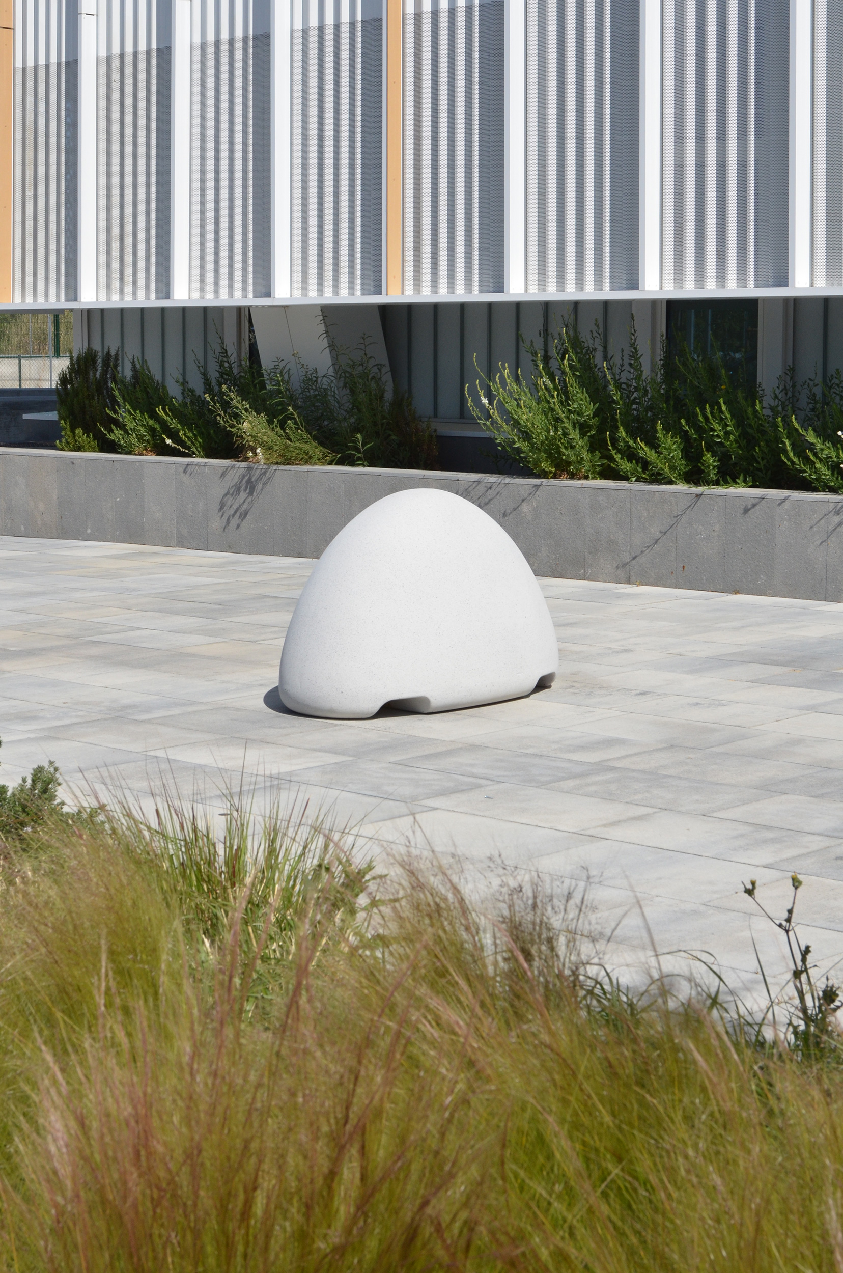 Concrete bollard with a friendly design without sharp edges