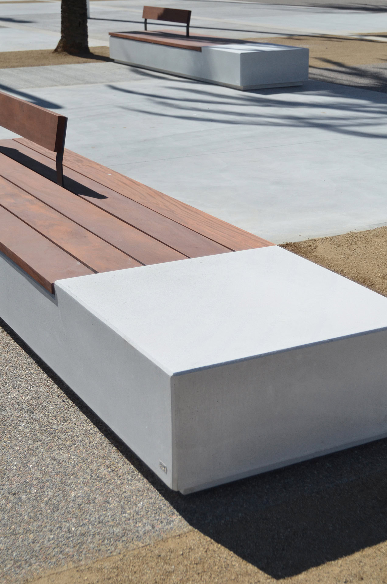 Urban park with parallelopiped-shaped benches and wooden seats