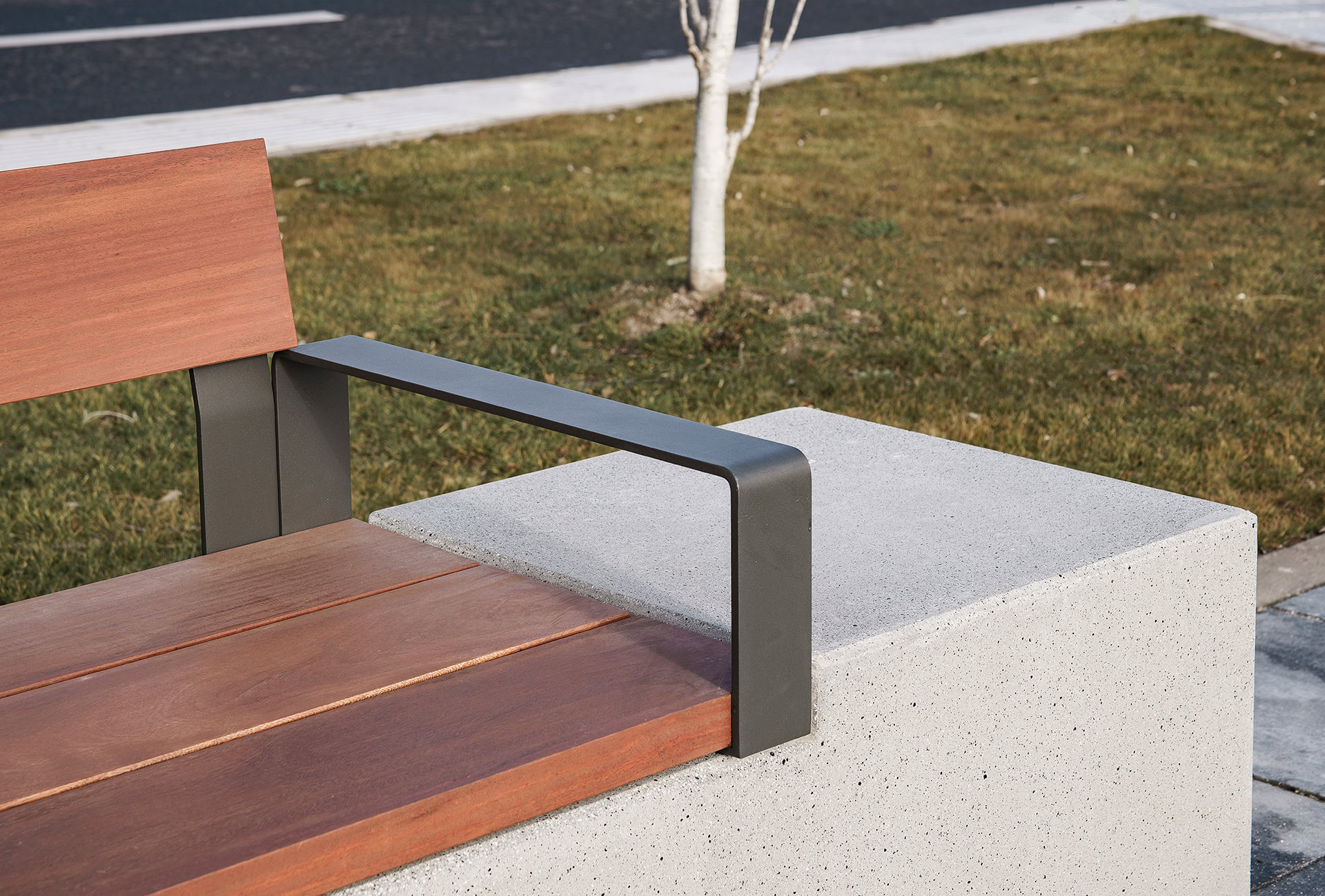 Comfortable bench with wooden seat and armrests for easy standing up